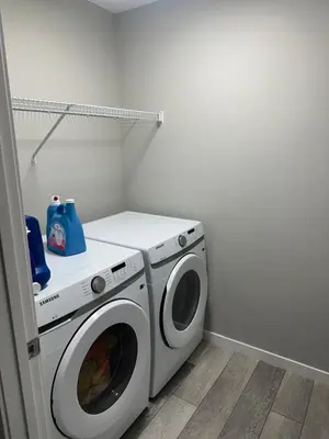 a washer and dryer in a laundry room at 3 Bedroom House in NW Calgary in Calgary