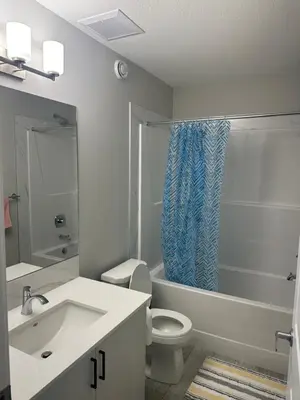 a bathroom with a sink and a toilet and a shower at 3 Bedroom House in NW Calgary in Calgary