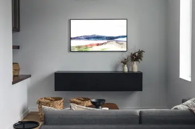 a living room with a couch and a picture on the wall at Lokis Loft and Cellar at the 1896 Building in Kaslo