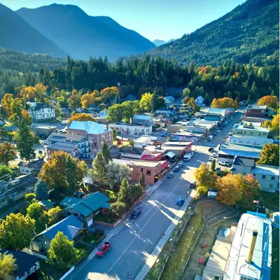 an aerial view of a small town in the mountains at Lokis Loft and Cellar at the 1896 Building in Kaslo