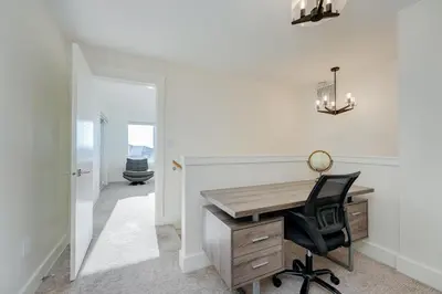 a home office with a desk and a chair at Elegant Home In Victoria,BC in Langford
