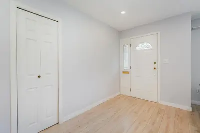 an empty room with white walls and white doors at Stunning House In Victoria, BC in Victoria