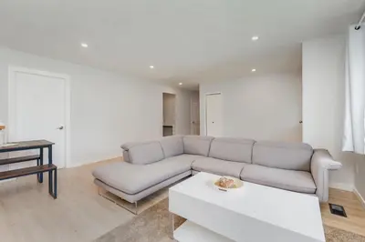 a living room with a couch and a table at Stunning House In Victoria, BC in Victoria