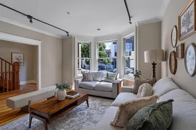 a living room with a couch and a table at The Vancouver Heritage Home - Mount Pleasant in Vancouver