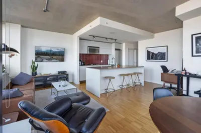 a living room with a couch and a table at The W, Modernized 2 bedroom Downtown Highrise in Vancouver