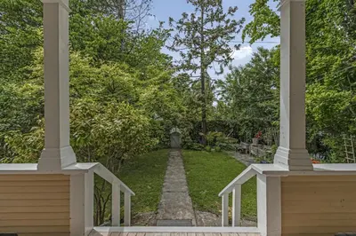 a view of a garden from the porch of a house at The Queen Elizabeth Park Home in Vancouver