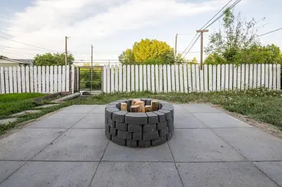 a fire pit made out of bricks on a sidewalk at Highland Park Upper Suite in Calgary