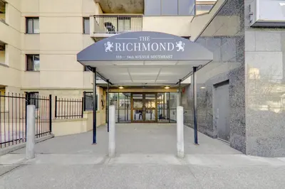 a building with a sign that reads the ricocheton at Spacious Top Floor at Stampede w Free Parking and AC in Calgary