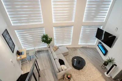 an overhead view of a living room with shuttered windows at Loft in Entertainment District with FREE underground Parking in Vancouver