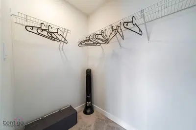 a room with a wall with a rack of musical notes at The Nest, 3BR, AC, Near YEG Airport, King Bed! in Edmonton