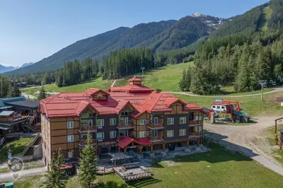 an aerial view of a large building with a red roof at Cornerstone Lodge by StayIn in Fernie