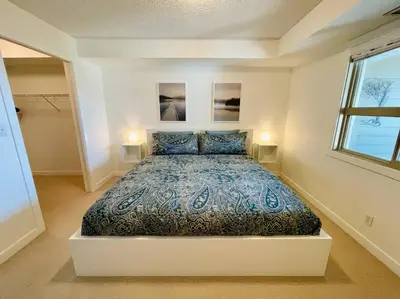 a bedroom with a large bed in a room at Lake View From Every Window! in Invermere