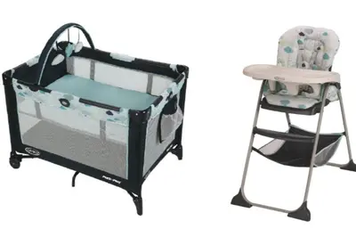 a baby crib and a high chair at Urban Pop Loft, Near ICE District, UG Parking in Edmonton
