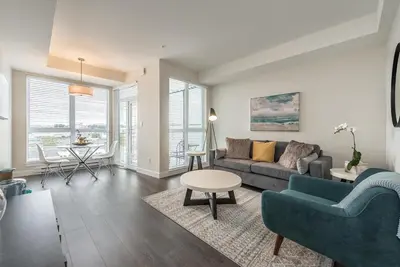 a living room with a couch and a table at Be The Lively Cityzen In Cityzen in Victoria