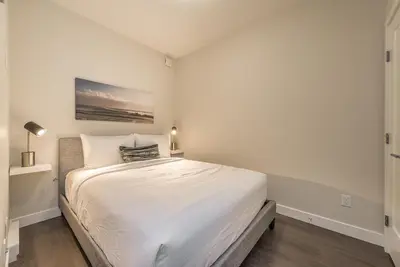 a white bedroom with a large bed in it at Be The Lively Cityzen In Cityzen in Victoria