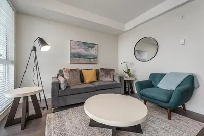 a living room with a couch and a chair and a table at Be The Lively Cityzen In Cityzen in Victoria