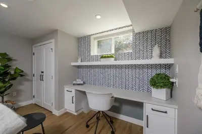 a home office with a desk and a window at Boho Bliss - Just steps away from the Hospital in Prince George