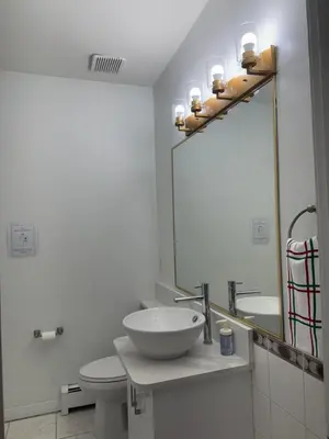 a bathroom with a sink and a mirror at Spacious Getaway in Surrey in Surrey