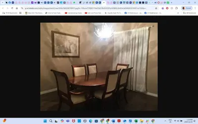 a dining room table and chairs in a room at Master Bedroom private bathroom 23 minutes airport in Edmonton