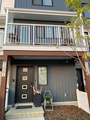 a house with a balcony and a front door at Humble Living in Edmonton