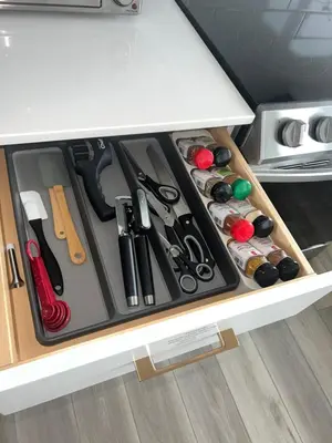 a drawer in a kitchen with scissors and other items at Humble Living in Edmonton