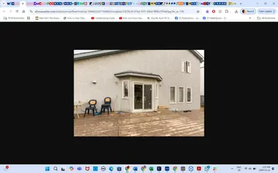a picture of a house with two chairs on a patio at Main floor room 4, 22 minute from airport in Edmonton