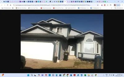 a picture of a house with a garage at Room # 2 sleep 4 Arrangement in Edmonton