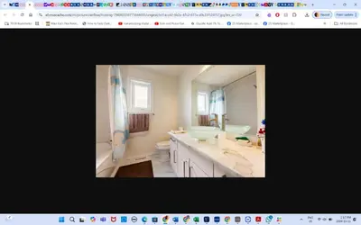 a bathroom with two sinks and a bath tub at Room # 2 sleep 4 Arrangement in Edmonton