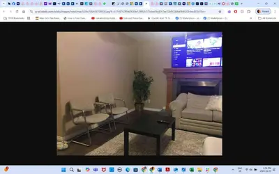 a living room with a couch and a table at Room # 3 Sleep 4 Arrangement in Edmonton