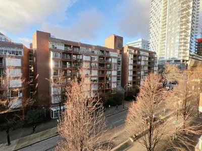 a view of a city with tall buildings and trees at Beautiful 2 Beds Dwtn apt Free Parking King Bed in Vancouver