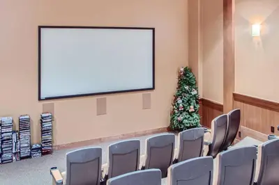 a conference room with a screen and a christmas tree at Stonegate Resort Unit A206 in Kelowna