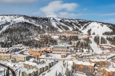 an aerial view of a resort in the snow at Winter Escape On Perfection - Ski In Out, Pool & Hot Tub in Big White