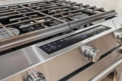 a close up of a stove top oven at Spacious 2bed with Hot Tub in Canmore