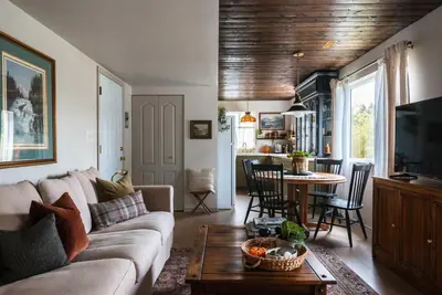 a living room with a couch and a table at The Reef guest suite in Sechelt