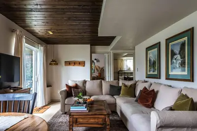 a living room with a couch and a table at The Reef guest suite in Sechelt