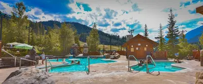 a pool in a resort with people playing in it at Horsethief Lodge by StayIn in Panorama