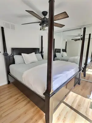 a bedroom with two beds and a ceiling fan at Taurean Vines Guest house in Keremeos