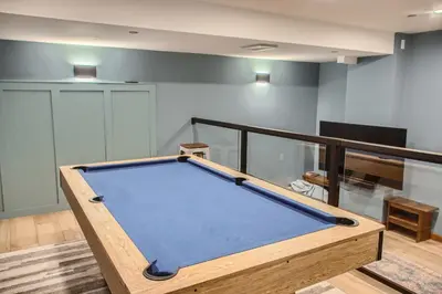 a pool table in the middle of a room at Moonshine Crescent 365 by Okanagan Premier in Big White