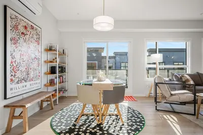 a living room with a glass table and chairs at Very Spacious Luxury Apartment with AC, 70