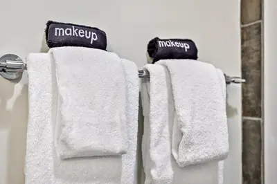 two towels hanging on a towel rack in a bathroom at Woodland Retreat 2 Bedroom in Canmore