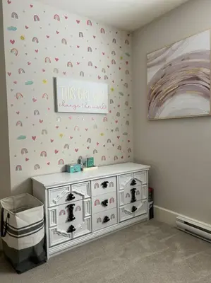 a room with a white dresser with a sign on the wall at Bright Spacious Entire Home with Kids Backyard Set in Victoria