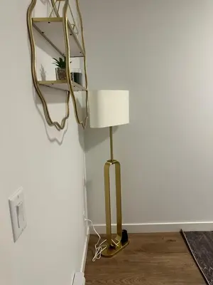 a lamp in a room with a mirror on the wall at A Cozy Private Suite in Rangeview, SE Calgary in Calgary