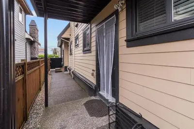 a walkway leading to the door of a house at Peaceful 2 Bedroom Suite that sleeps 4 with Free Wifi ,Free parking,easily accessible to Downtown Vancouver in Surrey
