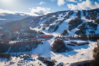 a snow covered mountain with a town on it at Mountain Escape for Ski and Golf Enthusiasts in Kimberley