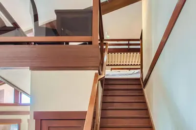 a staircase in a room with two bunk beds at Stonegate Resort Unit A403 in Kelowna