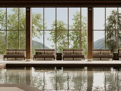a lobby with chairs and a pool of water at The Kenrick Hotel in Banff