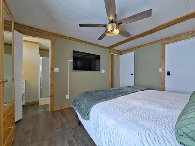 a bedroom with a bed and a ceiling fan at Hillcrest Hideaway: Spacious Mountain View Oasis in Hillcrest Mines