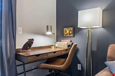 a desk with a bird sitting on top of it at Relaxing Mountain Getaway at Mystic Springs in Canmore