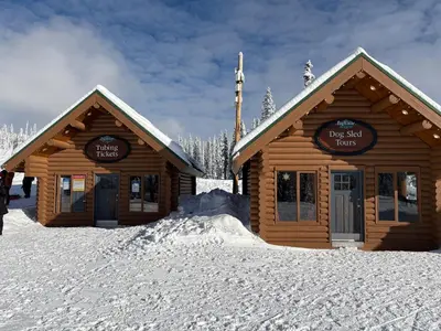 a log cabin with snow on the ground at Gone Ski 'Inn in Big White
