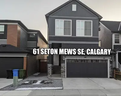 a house with a sign that says station meeks seady at Lovely 2Bd 1Bth suite Free pking separated HVAC in Calgary